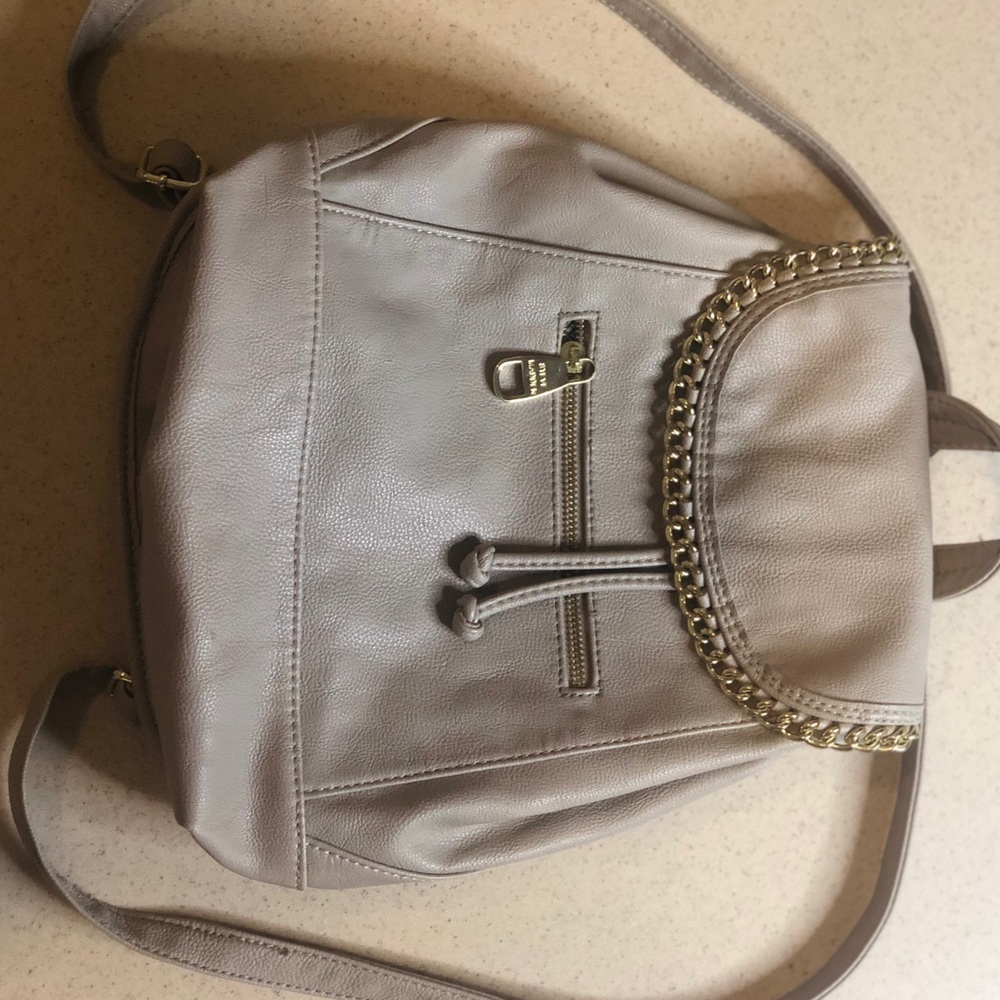 Cream backpack with gold chain